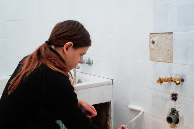 Girl painting bathroom